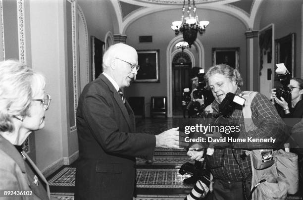 Sen. Pat Leahy, an amateur photographer, talks with photojournalist Scott Applewhite with the Associate Press in the halls of the U.S. Capitol...