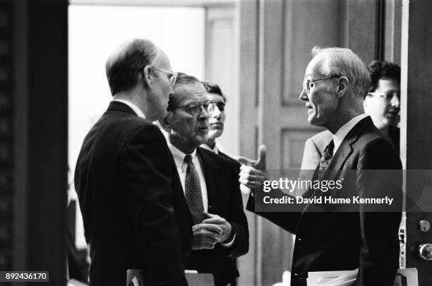 Republican senators Larry Craig of Idaho, Ted Stevens of Alaska, and Slate Gorton of Washington confers during the Senate Impeachment Trial of...