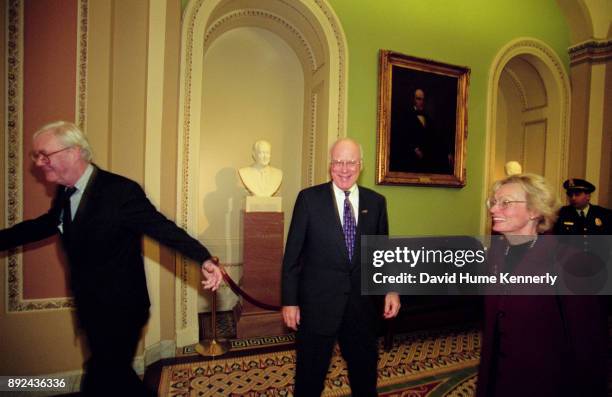 Senators Patrick Moynihan and Pat Leahy, with Leahy's wife Marcelle Pomerleau in the hallways of the U.S. Capitol Building during the Senate...