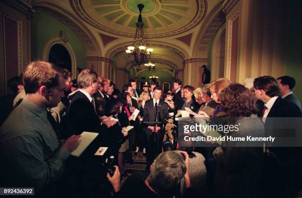 Senate Minority Leader Tom Daschle talks to reporters in the hallways of the U.S. Capitol Building during the Senate Impeachment Trial of President...