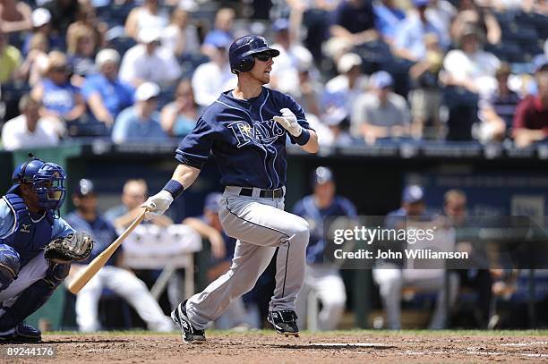 Ben Zobrist of the Tampa Bay Rays bats and runs to first base after hitting the ball during the game against the Kansas City Royals at Kauffman...