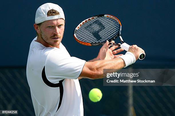 Alex Bogomolov returns a shot to Robbie Ginepri during the Indianapolis Tennis Championships on July 24, 2009 at the Indianapolis Tennis Center in...