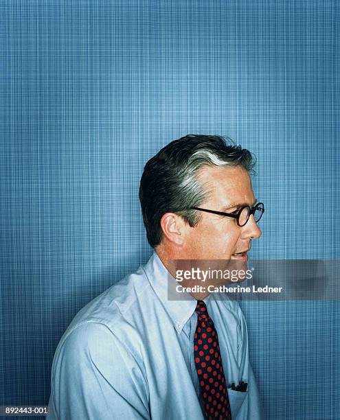 mature businessman wearing shirt and tie, profile - 55 59 anni foto e immagini stock