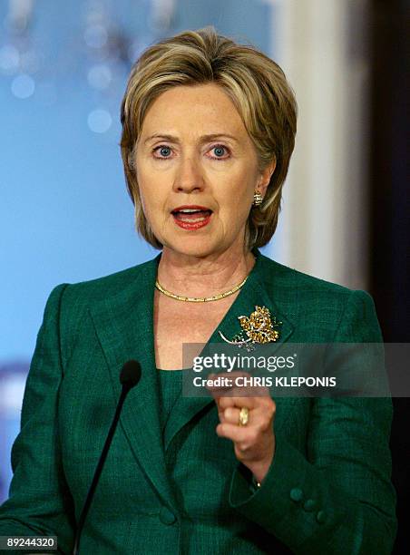 Secretary of State Hillary Clinton answers a reporter's question during a news briefing with Iraqi Prime Minister Nouri al-Maliki the State...