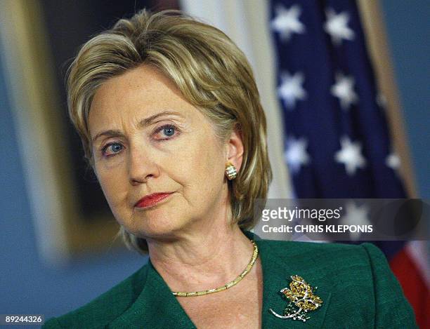 Secretary of State Hillary Clinton answers a reporter's question during a news briefing with Iraqi Prime Minister Nouri al-Maliki the State...
