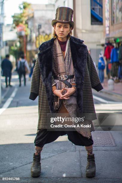 Yudai Takanashi, wearing a Steampunk Hater Absinthe top hat, a fur lined herringbone overcoat, a leopard print shirt, black harem pants, and brown...
