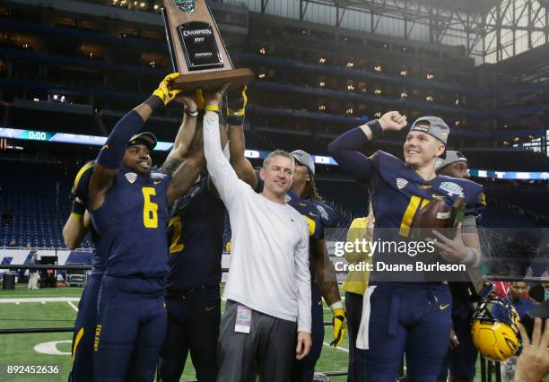 Cornerback Trevon Mathis of the Toledo Rockets, along with head coach Jason Candle of the Toledo Rockets and quarterback Logan Woodside of the Toledo...