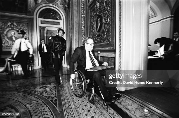 Lawyers for President Bill Clinton, including Lanny Breuer, Cheryl Mills and Charles Ruff, leave the Senate Chambers during break from the Senate...