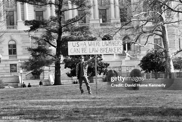 Protester outside the U.S. Capitol building on the second to last day of the Senate Impeachment Trial of President Bill Clinton on Feb. 11, 1999 in...
