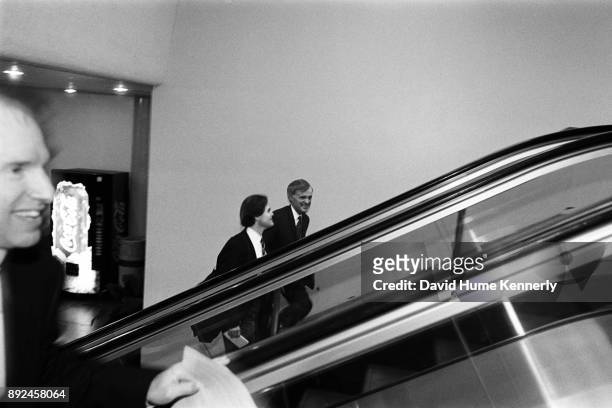 Sen. Bob Kerrey of Nebraska rides the escalator of the U.S. Capitol building on his way to the second to last day of the Senate Impeachment Trial of...
