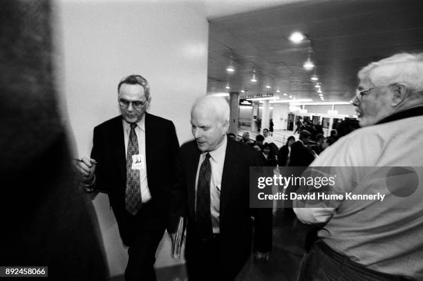 Republican Sen. John McCain of Arizona arrives at the U.S. Capitol building on his way to the second to last day of the Senate Impeachment Trial of...