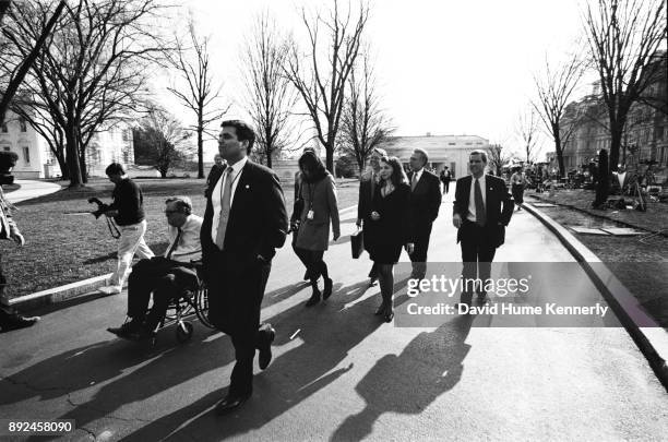 Lawyers for President Bill Clinton, including Charles Ruff, Cheryl Mills, Nicole Seligman, and Bruce Lindsey, walk through Lafayette Square on their...