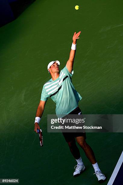 John Isner serves to Wayne Odesnik during the Indianapolis Tennis Championships on July 24, 2009 at the Indianapolis Tennis Center in Indianapolis,...