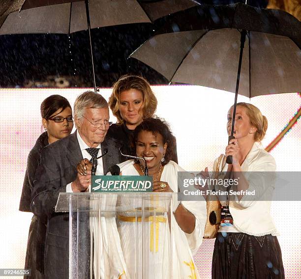 Actor Karl Heinz Boehm, his wife Almaz and daughter Aida attend the Save The World Awards at the nuclear power station Zwentendorf on July 24, 2009...