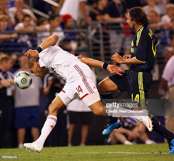 Oguchi Onyewu of AC Milan controls the ball against Claudio Pizarro of Chelsea FC at M & T Bank Stadium on July 24, 2009 in Baltimore, Maryland.