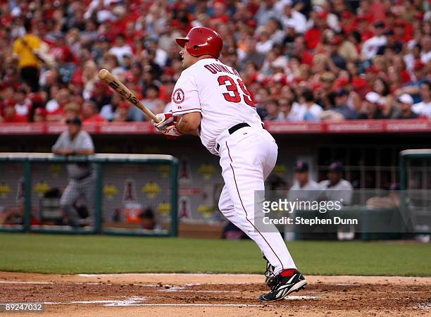 Robb Quinlan of the Los Angeles Angels of Anaheim hits a two-run home run in the second inning against the Minnesota Twins on July 24, 2009 at Angel...
