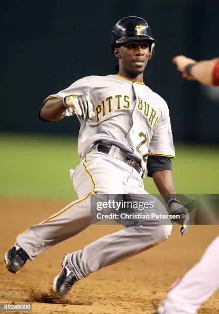 Andrew McCutchen of the Pittsburgh Pirates slides back into first base during the major league baseball game against the Arizona Diamondbacks at...