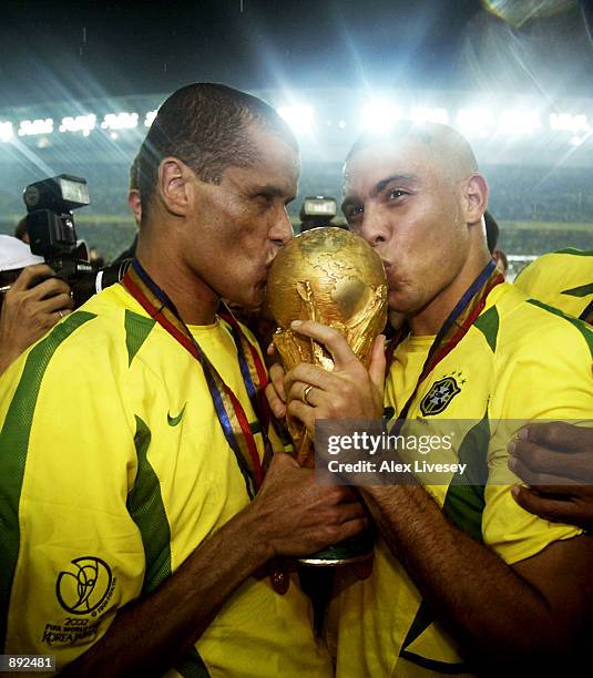 Rivaldo and Ronaldo of Brazil kiss the trophy after the Germany v Brazil, World Cup Final match played at the International Stadium Yokohama in...