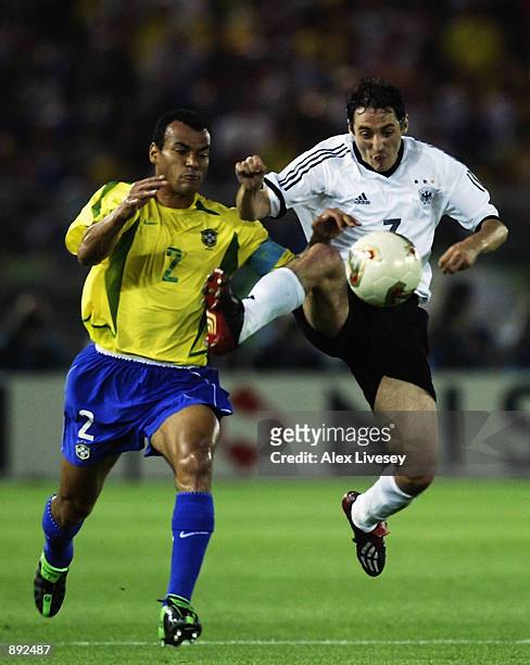 Oliver Neuville of Germany gets ahead of Cafu of Brazil during the Germany v Brazil, World Cup Final match played at the International Stadium...