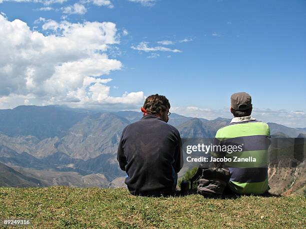two men sitting in the top of a mountain - sierra gorda stock pictures, royalty-free photos & images