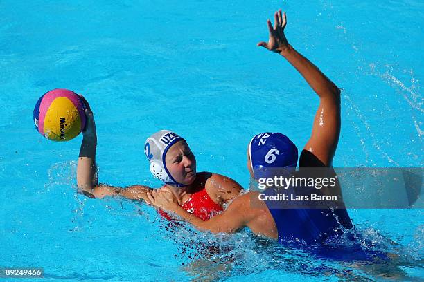 Diana Dadabaeva of Uzbekistan is challenged by Anna Zubkova of Kazakhstan in the Women's Water Polo Semifinals between Uzbekistan and Kazakhstan...