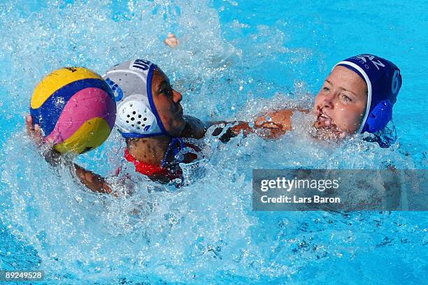 Ramilyn Halikova of Uzbekistan is challenged by Anna Zubkova of Kazakhstan in the Women's Water Polo Semifinals between Uzbekistan and Kazakhstan...