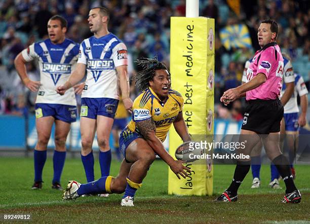 Fuifui Moimoi of the Eels celebrates after scoring a try during the round 20 NRL match between the Bulldogs and the Parramatta Eels at ANZ Stadium on...