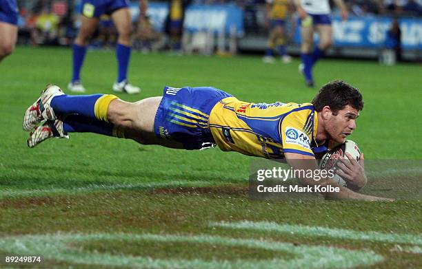 Kevin Kingston of the Eels dives over to score a try during the round 20 NRL match between the Bulldogs and the Parramatta Eels at ANZ Stadium on...