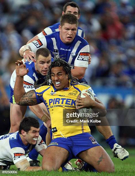 Fuifui Moimoi of the Eels is tackled during the round 20 NRL match between the Bulldogs and the Parramatta Eels at ANZ Stadium on July 25, 2009 in...