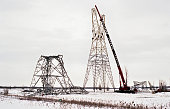 Fallen hydro towers, under reconstruction after the famous 1998 ice storm, in eastern Canada.