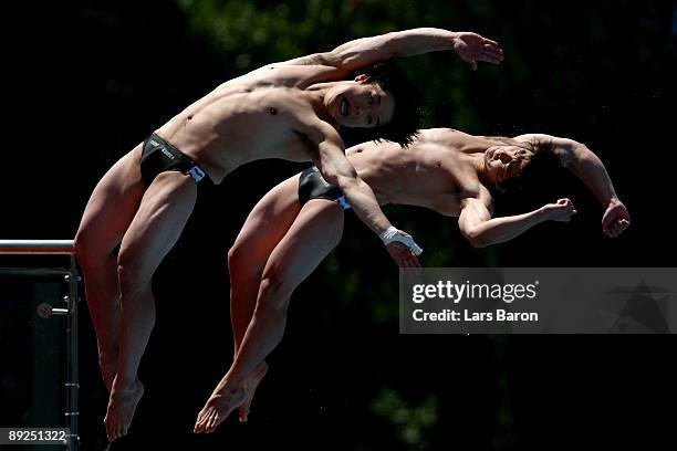 Kyungmin Kwon and Kwanhoon Cho of South Korea compete in the Men's 10m Synchro Platform Final during the 13th FINA World Championships at the Stadio...