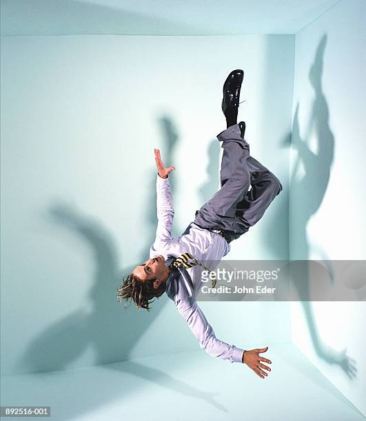 businessman floating in mid-air - levitating foto e immagini stock