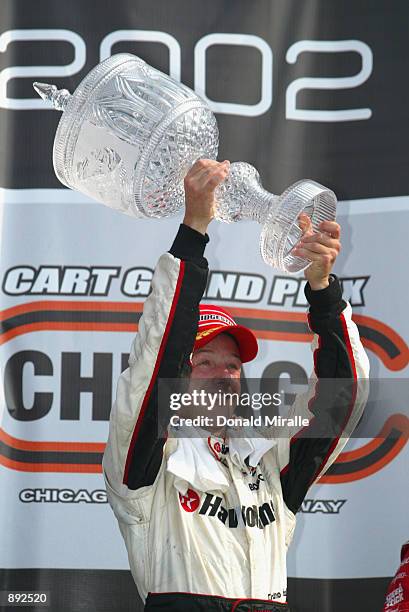 Cristiano da Matta celebrates winning the Grand Prix of Chicago round 7 of the CART FedEx Championship Series on June 30th 2002 at the Chicago Motor...