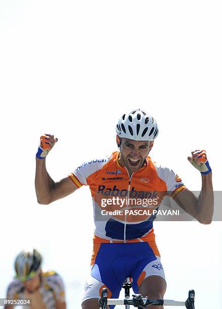 Dutch cycling team Rabobank 's Juan Manuel Garate of Spain jubilates on the finish line as winning ahead of US cycling Team Columbia-High Road 's...
