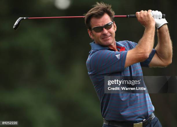 Sir Nick Faldo of England plays his second shot on the second hole during the third round of The Senior Open Championship presented by MasterCard...