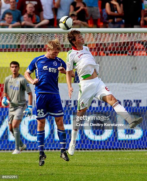 Diniyar Bilyaletdinov of FC Lokomotiv Moscow battles for the ball with Denis Kolodin of FC Dynamo Moscow during the Russian Football League...