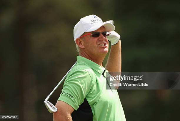 Sandy Lyle of Scotland reacts to a poor second shot into the second green during the third round of The Senior Open Championship presented by...