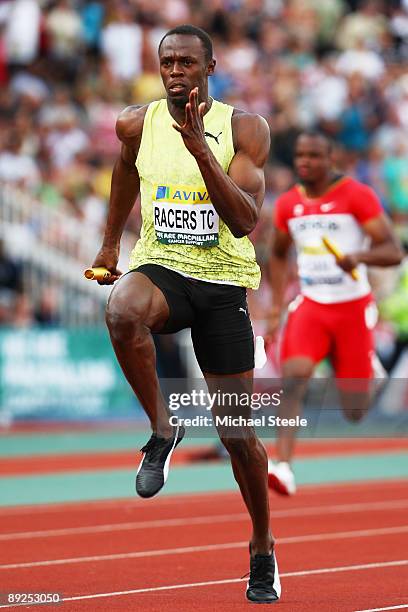 Usain Bolt of Jamaica powers towards the finish line in the Men's 4 x 100m Relay during day two of the Aviva London Grand Prix track and field...