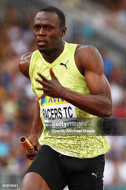 Usain Bolt of Jamaica powers towards the finish line in the Men's 4 x 100m Relay during day two of the Aviva London Grand Prix track and field...