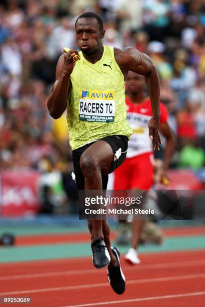 Usain Bolt of Jamaica powers towards the finish line in the Men's 4 x 100m Relay during day two of the Aviva London Grand Prix track and field...