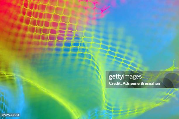 vibrant colors of tulle netting, close-up - organdy stockfoto's en -beelden