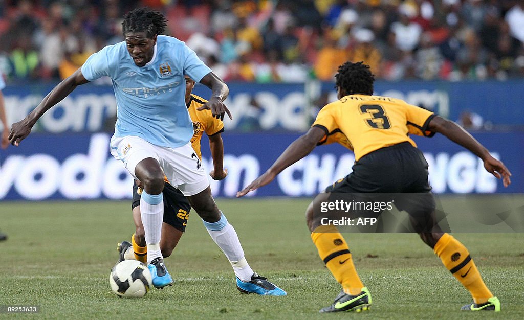 Emanuel Adebayor of Manchester City figh