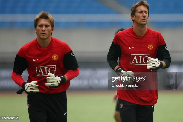 Goalkeeper Tomasz Kuszczak and Edwin Van der Sar of Manchester United train during a training session as part of the club's Asia Tour 2009 at Huang...