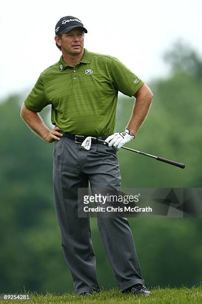 Retief Goosen of South Africa reacts to his second shot on the ninth hole during round two of the RBC Canadian Open at Glen Abbey Golf Club on July...