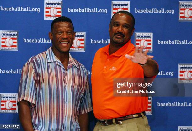 Inductees Rickey Henderson and Jim Rice pose for a photograph after speaking to the media at the Cooperstown Central School during the Baseball Hall...