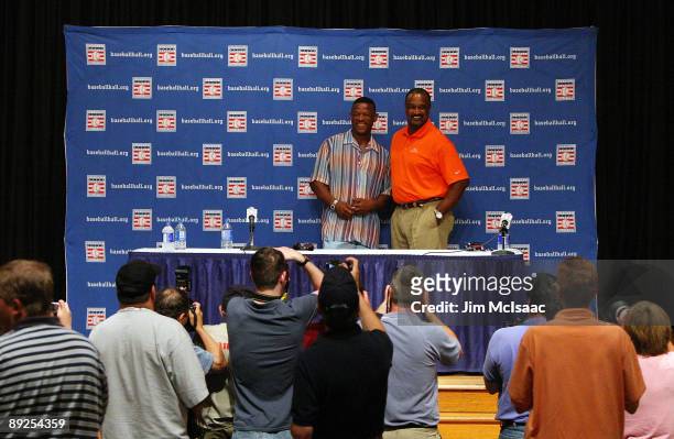 Inductees Rickey Henderson and Jim Rice pose for a photograph after speaking to the media at the Cooperstown Central School during the Baseball Hall...