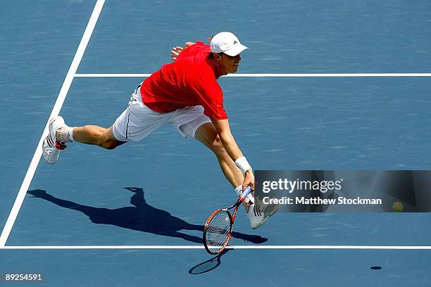 Sam Querrey lunges for a shot against Frank Dancevic of Canada during the semifinals of the Indianapolis Tennis Championships on July 25, 2009 at the...