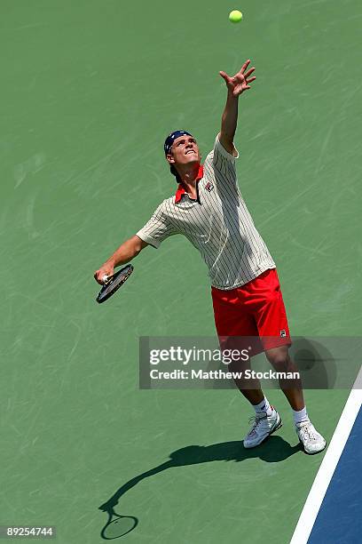 Frank Dancevic of Canada serves to Sam Querrey during the semifinals of the Indianapolis Tennis Championships on July 25, 2009 at the Indianapolis...