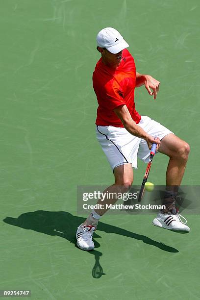 Sam Querrey returns a shot to Frank Dancevic of Canada during the semifinals of the Indianapolis Tennis Championships on July 25, 2009 at the...