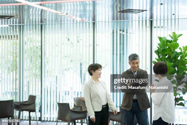 various age asian business team are meeting - hierarquia de corporação imagens e fotografias de stock